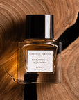 Essential Parfums Bois Imperial Extrait de Parfum by Quentin Bisch - product shown on top of wood