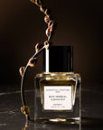 Essential Parfums Bois Imperial Extrait de Parfum by Quentin Bisch - product shown next to plant