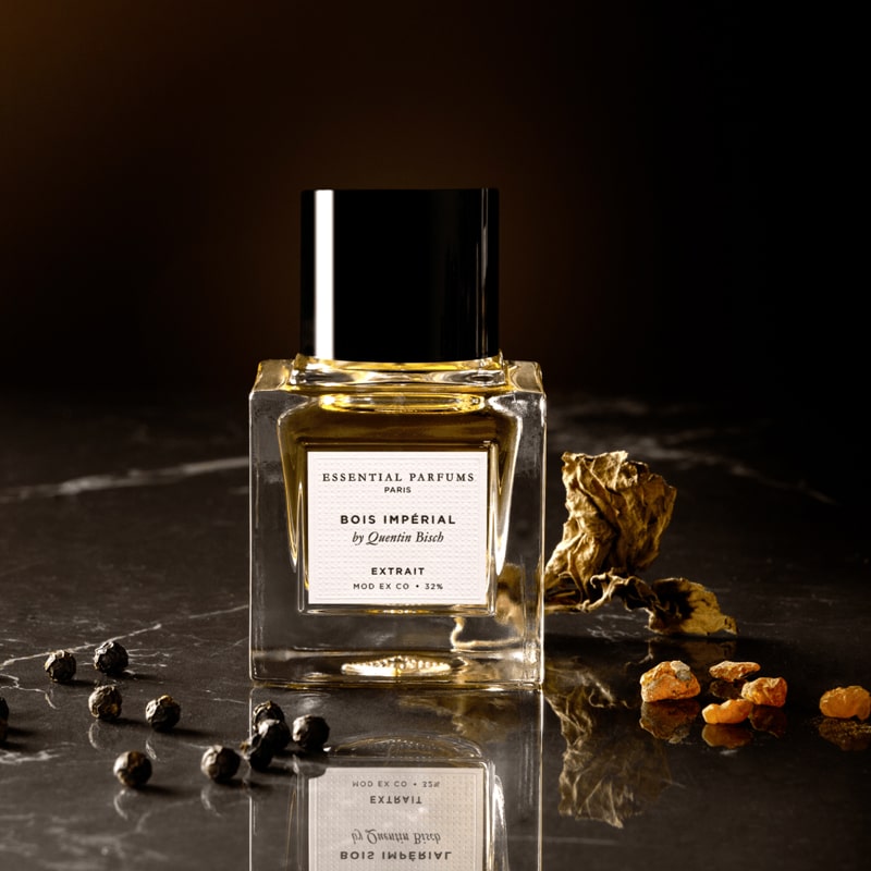 Essential Parfums Bois Imperial Extrait de Parfum by Quentin Bisch - product shown next to fragrance ingredients