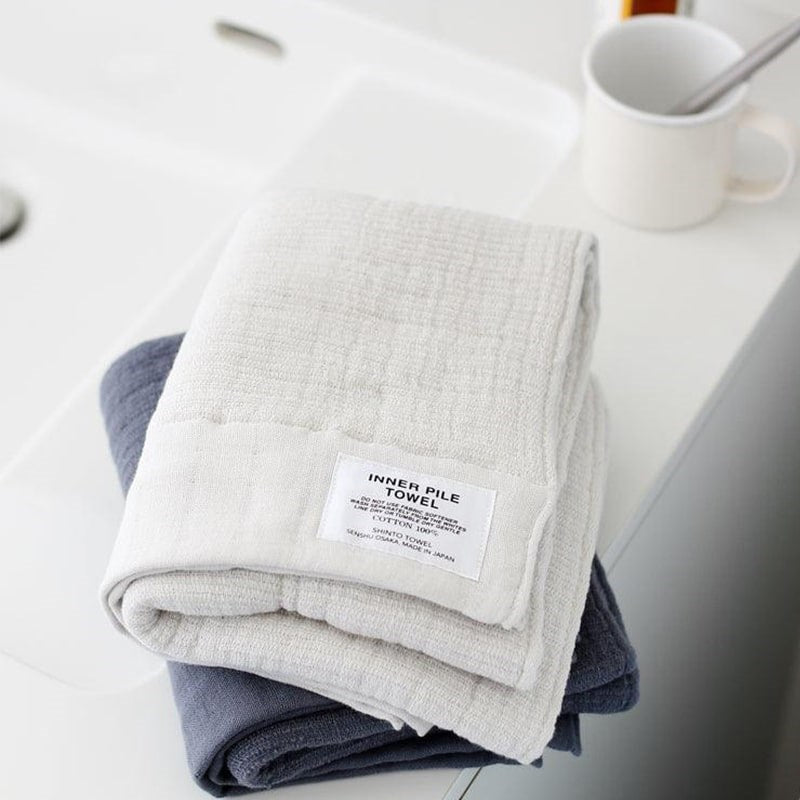 Shinto Towel Inner Pile Hand Towel - Ivory (medium) - product shown on bath tub