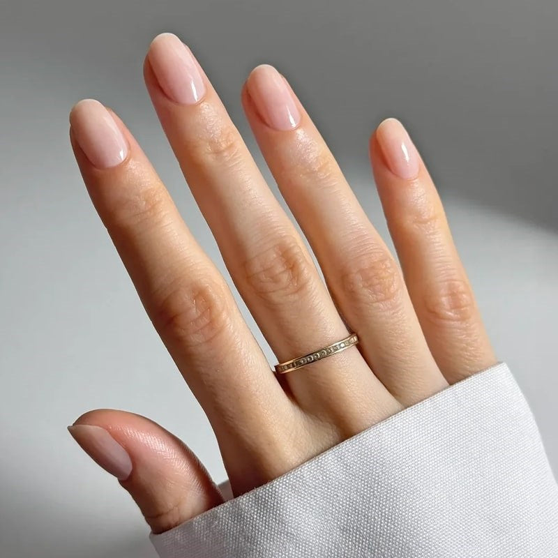 Kure Bazaar Colored Nail Hardener - Beige - models hand showing product on nails