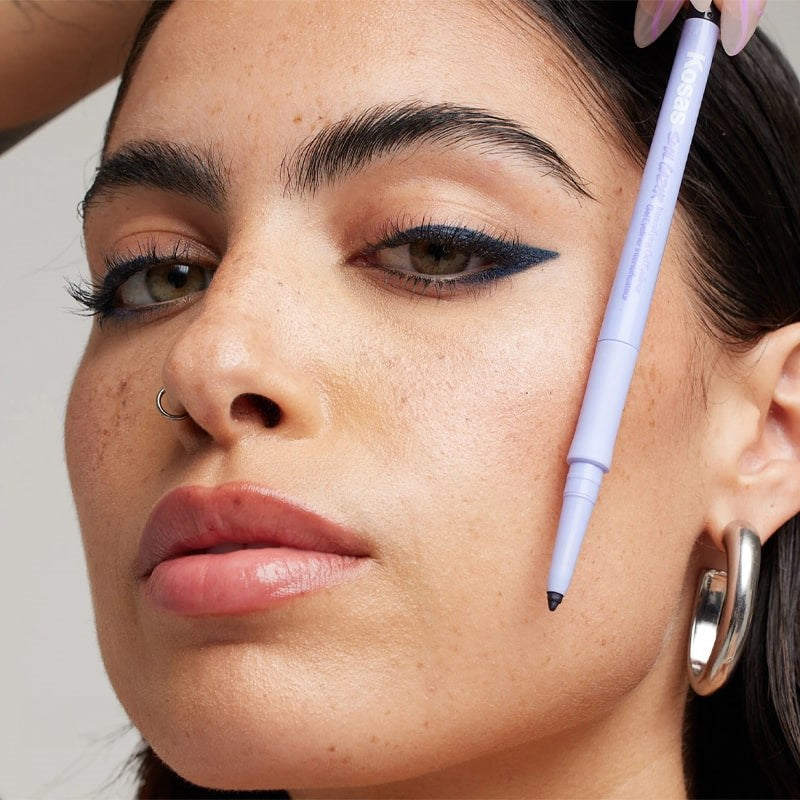 Kosas Soulgazer Eyeliner - Enigma - model shown wearing product and holding it