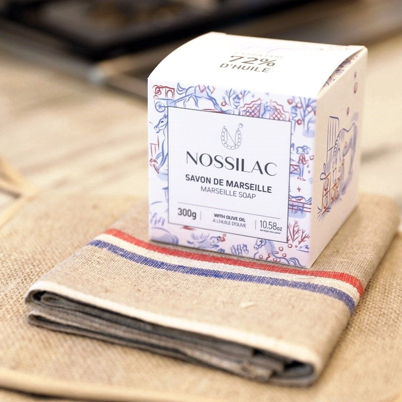 Nossilac Authentic Marseille Soap Cube - product packaging shown on towel