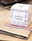 Nossilac Authentic Marseille Soap Cube - product packaging shown on towel