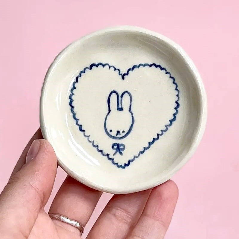 Model holding Alessia E Art Romantic Bunny Trinket Dish (1 pc)