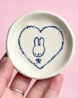 Model holding Alessia E Art Romantic Bunny Trinket Dish (1 pc)