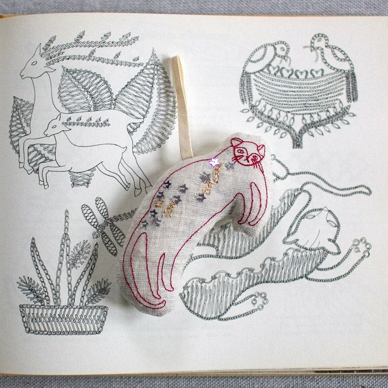 Skippy Cotton Baby Hugo Cat - Lavender Scented Token - product shown on top of illustrations 