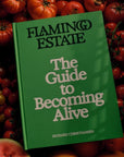 Flamingo Estate Organics The Guide to Becoming Alive - product shown on top of tomatoes