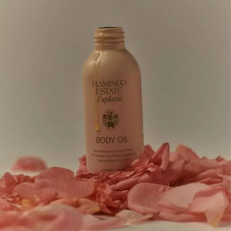 Flamingo Estate Organics Damask Rose & Bergamot Body Oil - product shown on bed of rose petals