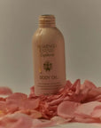 Flamingo Estate Organics Damask Rose & Bergamot Body Oil - product shown on bed of rose petals