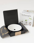 Botanopia Porcelain Germination & Propagation Plate - Small - product shown inside packaging next to included brochure 