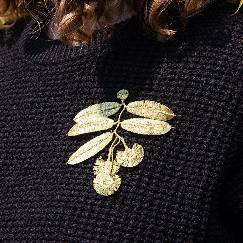 Botanopia Embroidered Brooch - Eucalyptus Flowers - model shown wearing product