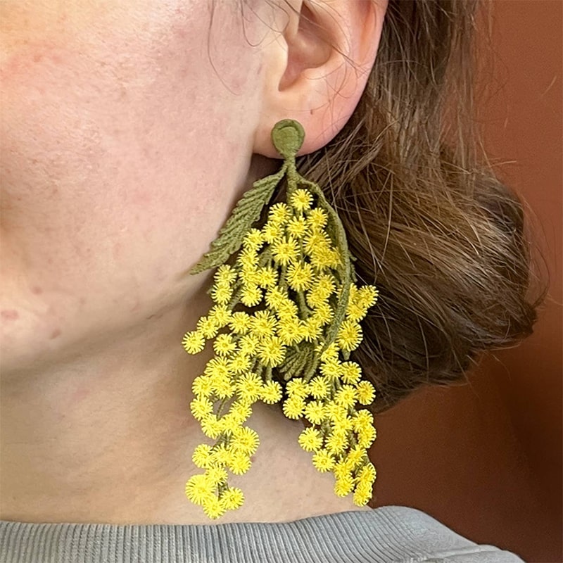 Botanopia Embroidered Brooch - Mimosa Flowers - model shown wearing product as earring