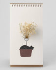 Beyond123 Cat Flip Vase (1 pc) showing cat illustration with dried flowers in vase