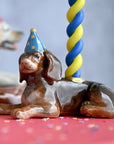 Camp Hollow Dachshund Cake Topper - product shown with candle in it