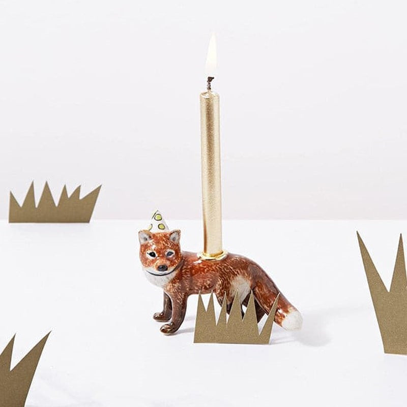 Camp Hollow Red Fox Cake Topper - product shown with lit candle in it next paper bushes