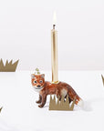 Camp Hollow Red Fox Cake Topper - product shown with lit candle in it next paper bushes