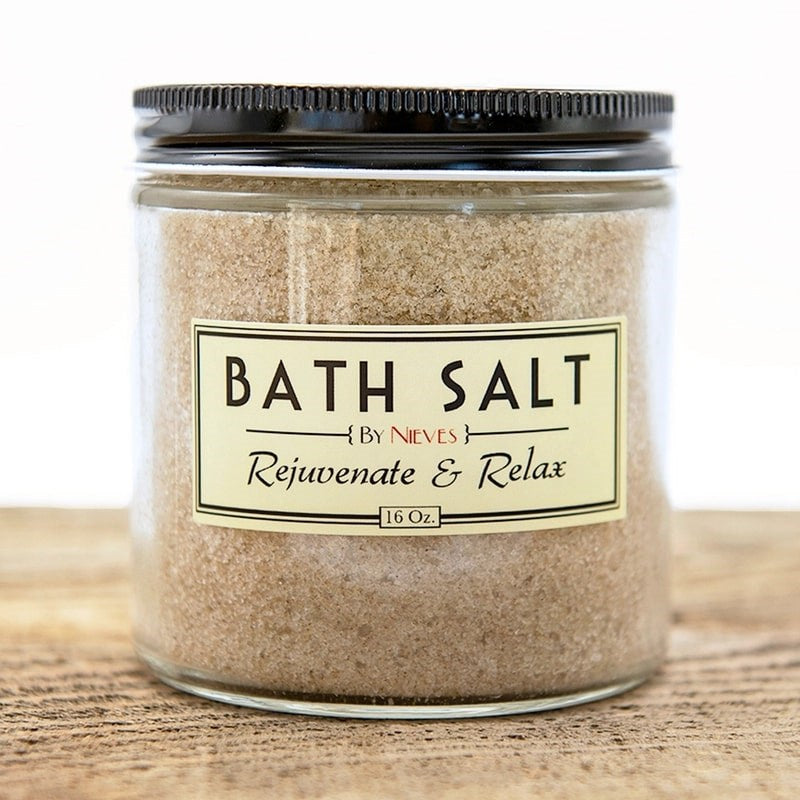 By Nieves Rejuvenating & Relaxing Bath Salts (16 oz) - product shown on wooden table