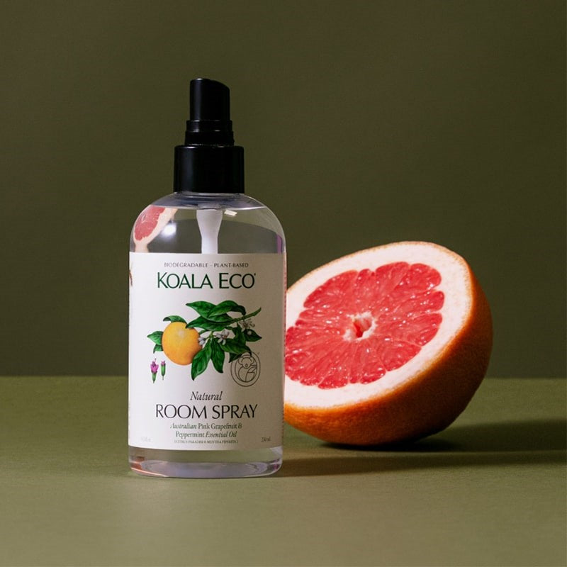 Koala Eco Natural Room Spray - Pink Grapefruit and Peppermint Essential Oil - product shown next to sliced grapefruit 