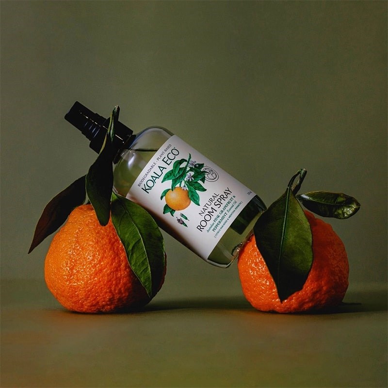 Koala Eco Natural Room Spray - Pink Grapefruit and Peppermint Essential Oil - product shown on top of two grapefruits