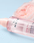 Nuxe Very Rose Refreshing Toning Mist - Closeup of product with flower in background