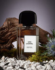 Beauty shot of BDK Parfums Gris Charnel Eau de Parfum (100 ml) in front of wood